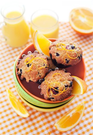 simsearch:400-07034479,k - Fresh orange muffins in a bowl decorated with zest Stock Photo - Budget Royalty-Free & Subscription, Code: 400-07301543