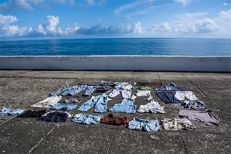 simsearch:400-07301871,k - Drying clothes on the pavement at seafront, Baracoa, Cuba Stock Photo - Budget Royalty-Free & Subscription, Code: 400-07301870