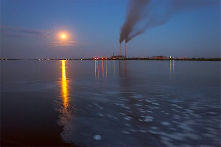 Power station in the evening, with lights and smoke reflection in water, full moon, long exposure Stock Photo - Budget Royalty-Free & Subscription, Code: 400-07302240