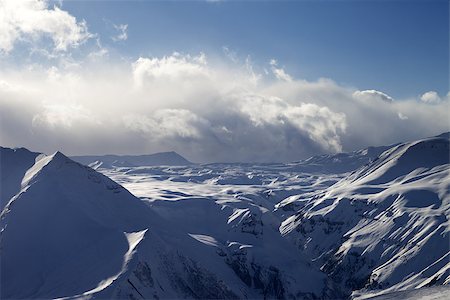 simsearch:400-07219033,k - Snow plateau in evening and sunlight clouds. Caucasus Mountains, Georgia, view from ski resort Gudauri. Stock Photo - Budget Royalty-Free & Subscription, Code: 400-07302678