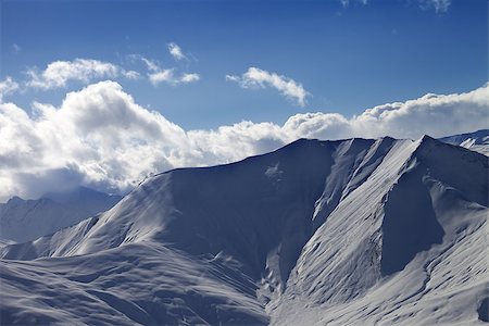 simsearch:400-07211845,k - Off piste slope in evening with sunlit clouds. Ski resort Gudauri. Caucasus Mountains, Georgia. Stockbilder - Microstock & Abonnement, Bildnummer: 400-07302673