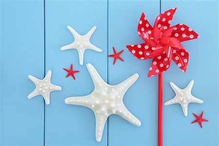 seashell photo concept - Starfish sea shells and red toy windmill over wooden blue background. Stock Photo - Budget Royalty-Free & Subscription, Code: 400-07303449