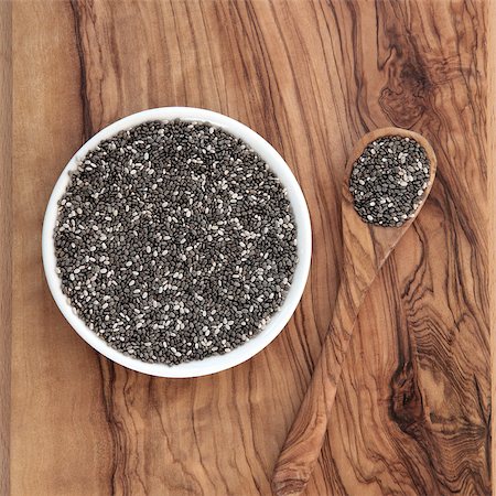 Chia seed healthy super food over olive wood background. Salvia hispanica. Photographie de stock - Aubaine LD & Abonnement, Code: 400-07303450