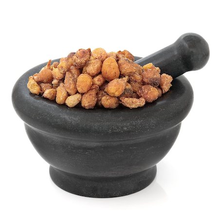 simsearch:400-06521200,k - Pinellia tuber chinese herbal medicine in a black stone mortar with pestle over white background. Ban xia. Stock Photo - Budget Royalty-Free & Subscription, Code: 400-07303603