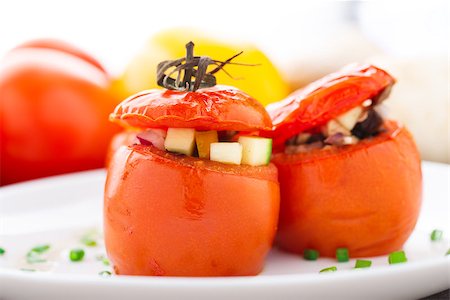 Three delicious stuffed tomatoes on a white plate Stock Photo - Budget Royalty-Free & Subscription, Code: 400-07314489