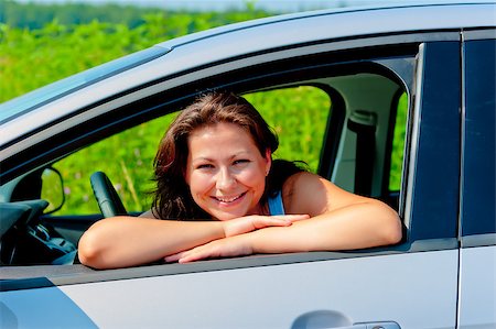 Happy female driver in her new car Stock Photo - Budget Royalty-Free & Subscription, Code: 400-07314714