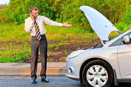 businessman in a car crash Stock Photo - Budget Royalty-Free & Subscription, Code: 400-07314723