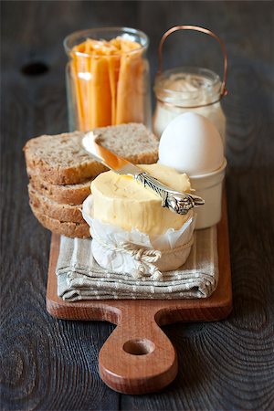 Boiled egg, cheese and bread with butter for breakfast. Stock Photo - Budget Royalty-Free & Subscription, Code: 400-07314798