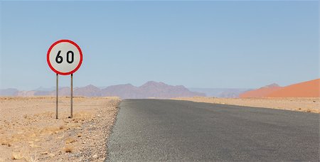 Speed limit sign at a desert road in Namibia, speed limit of 60 kph Stock Photo - Budget Royalty-Free & Subscription, Code: 400-07315403