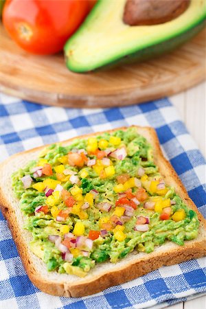 sandwich with avocado - Delicious vegetarian sandwich with avocado and vegetables Stock Photo - Budget Royalty-Free & Subscription, Code: 400-07315499