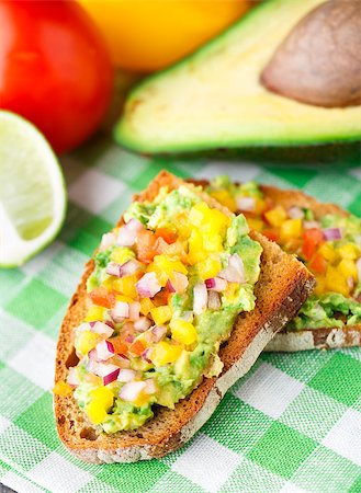sandwich with avocado - Delicious vegetarian sandwich with avocado and vegetables Stock Photo - Budget Royalty-Free & Subscription, Code: 400-07315501