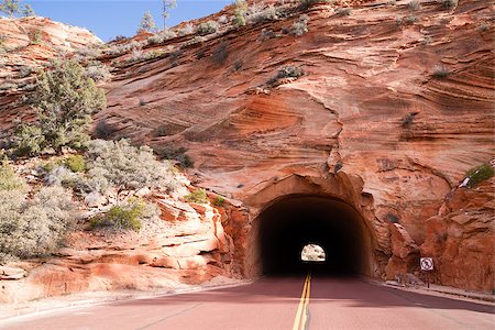 simsearch:400-07316198,k - No pedestrians, they used the red rock from the mountainsides to make the asphalt for the road, color is not shifted in this photo. Foto de stock - Super Valor sin royalties y Suscripción, Código: 400-07316202