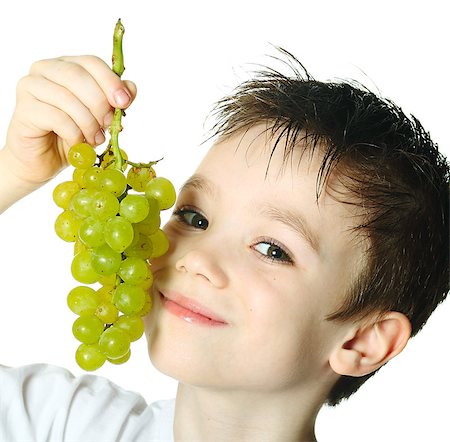 simsearch:400-06177351,k - Healthy eating concept with child eating grapes isolated on white Stock Photo - Budget Royalty-Free & Subscription, Code: 400-07316538