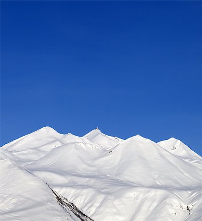simsearch:400-04588712,k - Snowy mountains and blue sky at nice day. Caucasus Mountains, Georgia, Gudauri. Stock Photo - Budget Royalty-Free & Subscription, Code: 400-07316602