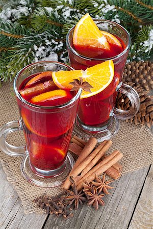 Christmas mulled wine with spices and snowy fir tree on wooden table Stock Photo - Budget Royalty-Free & Subscription, Code: 400-07316740