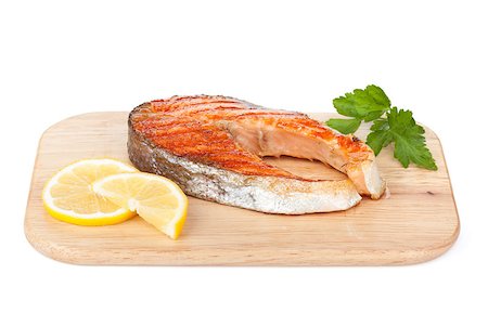 simsearch:400-04714794,k - Grilled salmon with lemon and herbs on cutting board. Isolated on white background Stock Photo - Budget Royalty-Free & Subscription, Code: 400-07316787