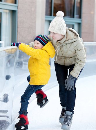 happy family of two enjoying ice skating at winter Stock Photo - Budget Royalty-Free & Subscription, Code: 400-07316867