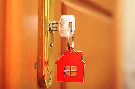 A key in a lock with house icon on it Fotografie stock - Microstock e Abbonamento, Codice: 400-07317012