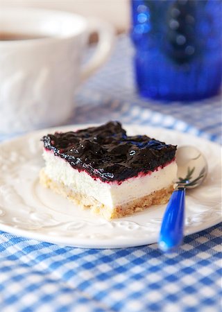 simsearch:400-06365777,k - Delicious blueberry squares cake with whip cream on checkered tablecloth Stock Photo - Budget Royalty-Free & Subscription, Code: 400-07317454