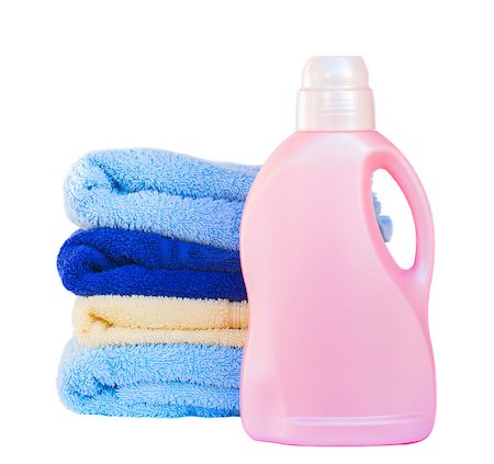 detergente - Towels  with detergent isolated on white background Foto de stock - Super Valor sin royalties y Suscripción, Código: 400-07318062