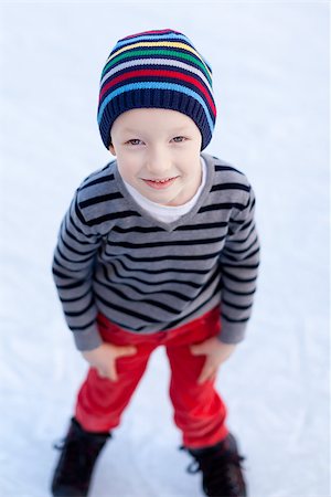 simsearch:400-08318057,k - smiling positive boy ice skating at winter Stock Photo - Budget Royalty-Free & Subscription, Code: 400-07318108