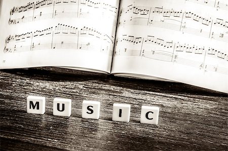 simsearch:400-04652609,k - Music notes sheet and letters music in vintage style Photographie de stock - Aubaine LD & Abonnement, Code: 400-07318718