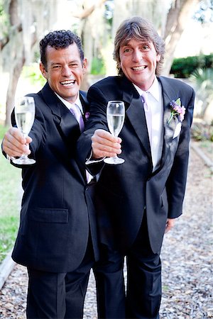 Two handsome grooms making a champagne toast at their wedding. Photographie de stock - Aubaine LD & Abonnement, Code: 400-07318710