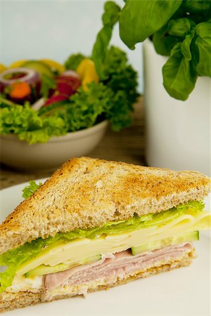 fresh tasty club sandwich with cheese and ham on wooden table Stockbilder - Microstock & Abonnement, Bildnummer: 400-07319722