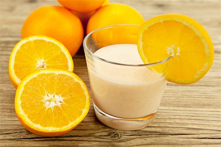 simsearch:400-08494395,k - fresh tropical orange yoghurt shake dessert on wooden background Foto de stock - Super Valor sin royalties y Suscripción, Código: 400-07319755