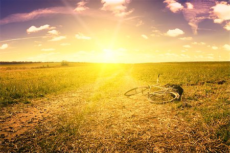 simsearch:400-04552473,k - Gloomy dawn on rural road in field. Bicycle. Stock Photo - Budget Royalty-Free & Subscription, Code: 400-07319972