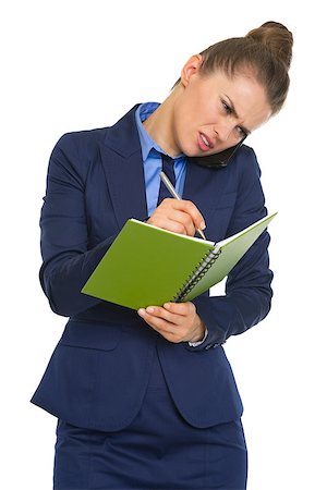 female manager talking to concerned employee - Concerned business woman talking mobile phone and writing in notepad Stock Photo - Budget Royalty-Free & Subscription, Code: 400-07310233