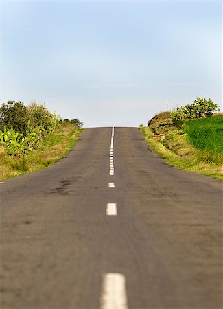 simsearch:400-08071939,k - Long Country Road with Markings on Blue Sky Background Stock Photo - Budget Royalty-Free & Subscription, Code: 400-07310272