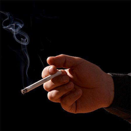 smoke isolated - Cigarette In Hand On black Stock Photo - Budget Royalty-Free & Subscription, Code: 400-07311738