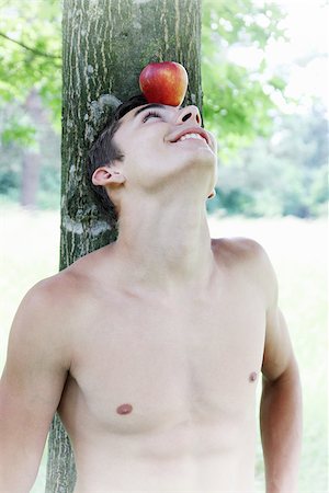 man with an apple on his head Stockbilder - Microstock & Abonnement, Bildnummer: 400-07311766
