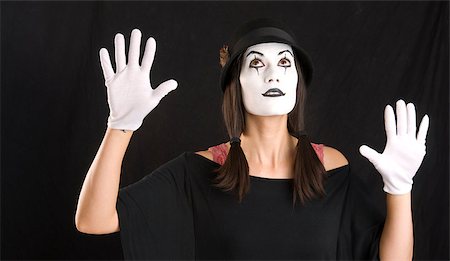 A beautiful and curious Mime peeks upwards Stock Photo - Budget Royalty-Free & Subscription, Code: 400-07311855