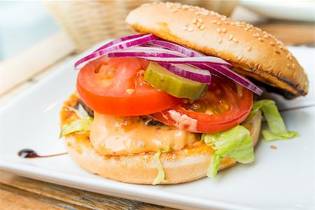 simsearch:400-05330097,k - Cheese burger - American cheese burger with fresh salad Stock Photo - Budget Royalty-Free & Subscription, Code: 400-07311961