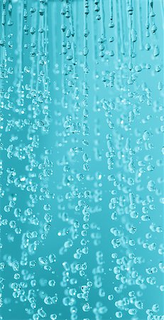 Shower head drops and streams of water. Blue toned. Fotografie stock - Microstock e Abbonamento, Codice: 400-07312496