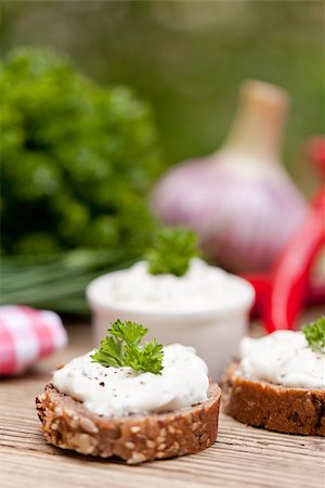 fresh tasty homemade cream cheese and herbs with bread on wooden table Stock Photo - Budget Royalty-Free & Subscription, Code: 400-07312966