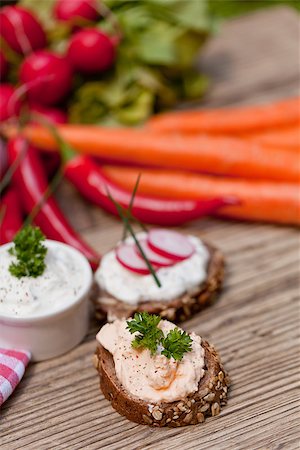 fresh tasty homemade cream cheese and herbs with bread on wooden table Stock Photo - Budget Royalty-Free & Subscription, Code: 400-07312980
