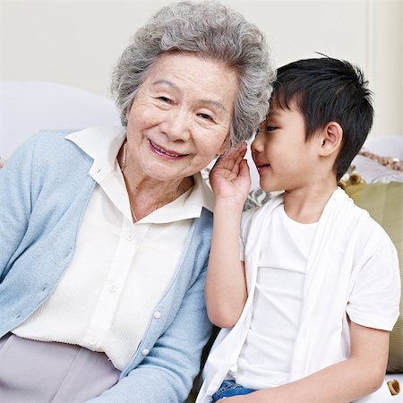 seniors and whispering - grandson telling grandma a secret. Stock Photo - Budget Royalty-Free & Subscription, Code: 400-07313312