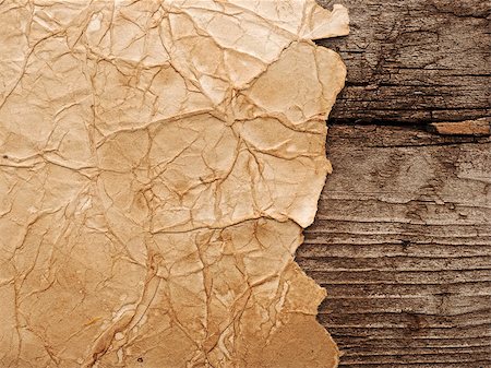 Old paper on brown wood board Stock Photo - Budget Royalty-Free & Subscription, Code: 400-07313833