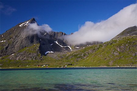 simsearch:400-06946273,k - Picturesque sandy beach along fjord with mountain peaks high in the clouds on Lofoten islands in Norway Photographie de stock - Aubaine LD & Abonnement, Code: 400-07313864