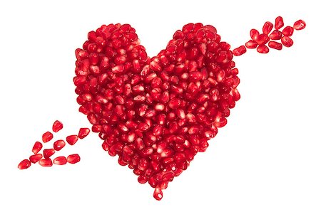 red seed passion fruit - Pomegranate seeds in heart shape with arrow isolated on white background. Stock Photo - Budget Royalty-Free & Subscription, Code: 400-07313971