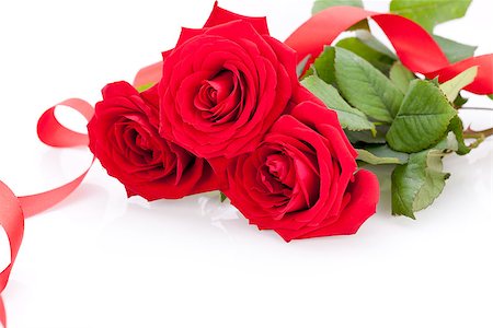 simsearch:689-03124881,k - Bouquet of beautiful fresh red roses with a coiled ribbon border isolated on white with plenty of copyspace for your loving anniversary or Valentines message Foto de stock - Super Valor sin royalties y Suscripción, Código: 400-07324000