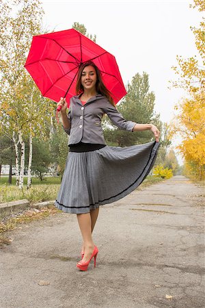 Happy woman outdoor in autamn with red umbrella Stock Photo - Budget Royalty-Free & Subscription, Code: 400-07324235