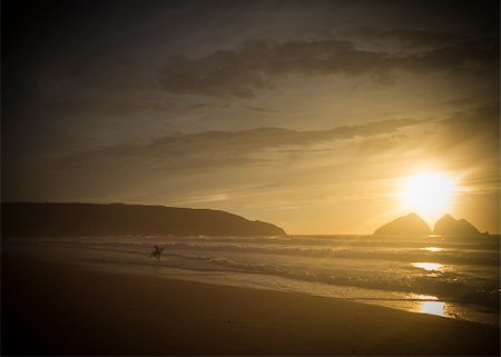 silhouette of a surfers  at sunset,  holywell bay, newquay UK Stock Photo - Budget Royalty-Free & Subscription, Code: 400-07325537
