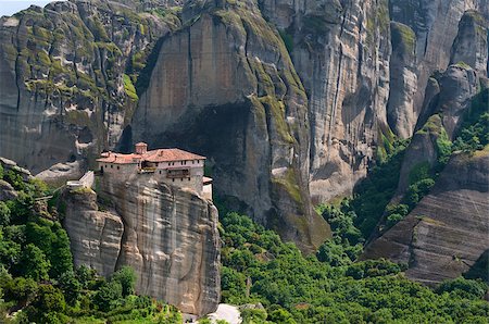 simsearch:400-06696238,k - The Holy Monastery of Rousanou or St. Barbara is one of Meteora rock pillars in Greece. This is good combination of ancient architecture and mountain landscape. Fotografie stock - Microstock e Abbonamento, Codice: 400-07326002