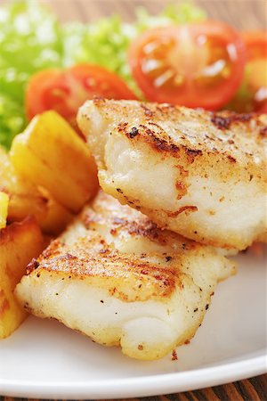 roasted fish - roasted codfish fillet with vegetables, selective focus Stock Photo - Budget Royalty-Free & Subscription, Code: 400-07326014
