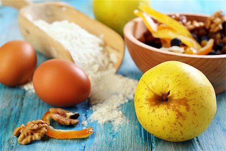 preparation of apple pie - Apple, nuts, candied fruits and flour on the old table. Stock Photo - Budget Royalty-Free & Subscription, Code: 400-07326045