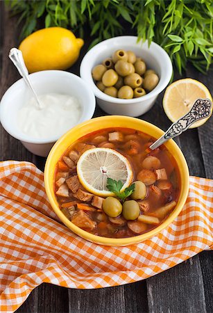 stew sausage - Solyanka - russian soup with meat, sausage, olives and lemon Stock Photo - Budget Royalty-Free & Subscription, Code: 400-07326081